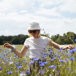 Woman enjoying spring in a wildflower field