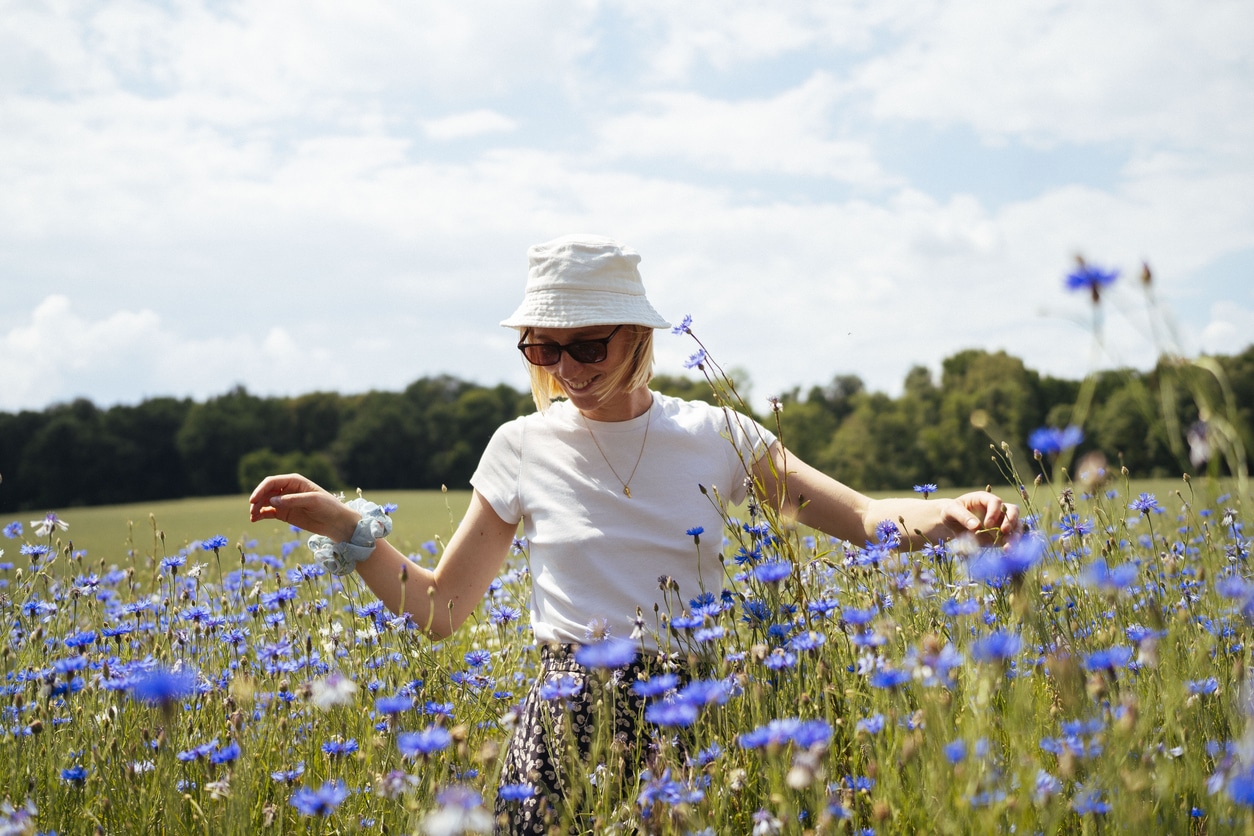 Woman enjoying spring in a wildflower field.