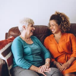 Young woman laughing with her grandma